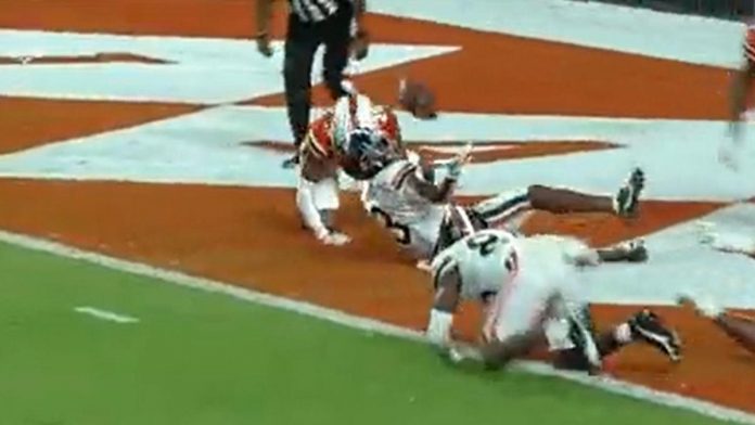 watch:-virginia-wr-dontayvion-wicks-makes-incredible-td-catch-while-laying-on-his-back-vs.-miami