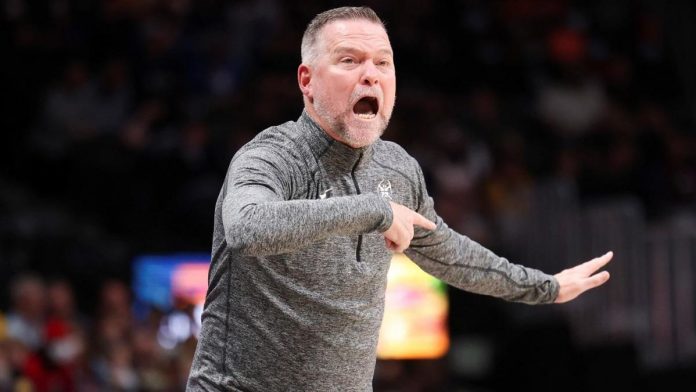 watch:-nuggets’-head-coach-michael-malone-ejected-after-running-on-to-court,-getting-held-back-by-nikola-jokic